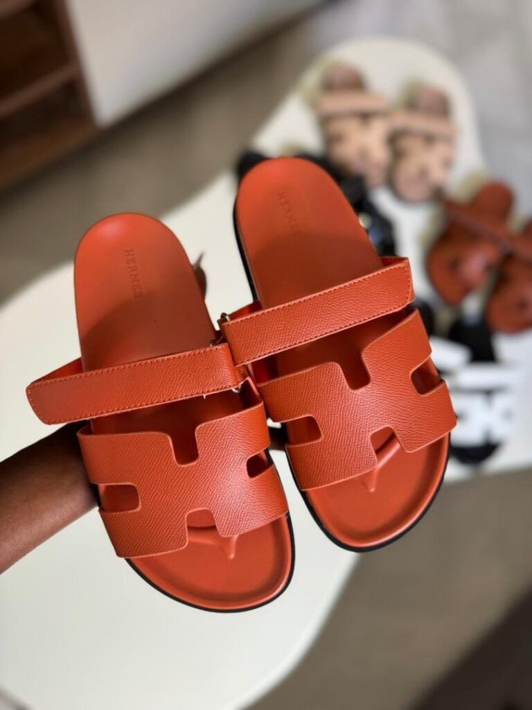 HERMES CHYPRE SANDALS — ORANGE