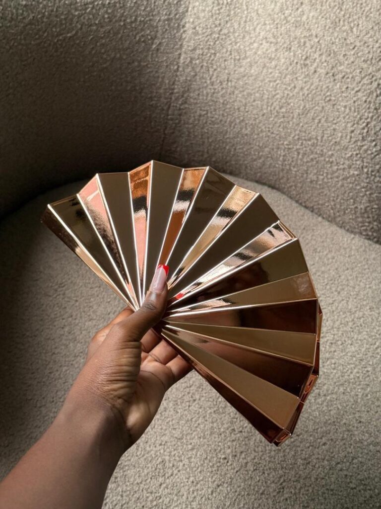 Sculpted Mirror Clutch Bag – Rose Gold Edition